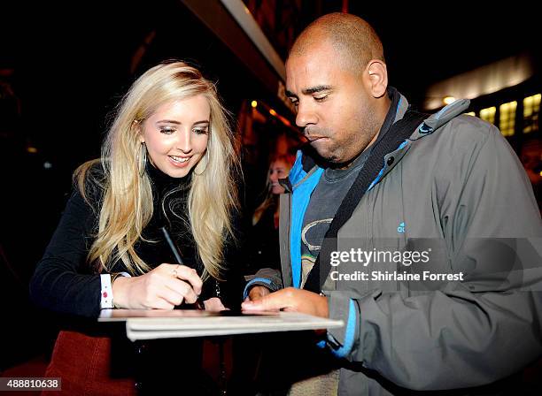 Alice Barlow signs autugraphs for fans while attending the 15th birtday party of Hard Rock Cafe on September 17, 2015 in Manchester, England.