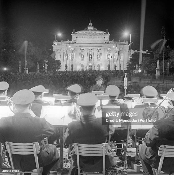 An orchestra playing in front of the Vienna State Opera for the reopening of the theatre. Vienna, November 1955