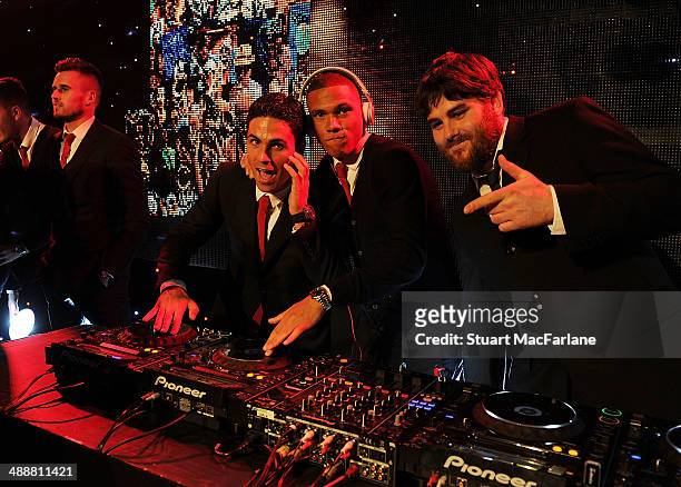Mikel Arteta and Kieran Gibbs of Arsenal with Piers Agget from Rudamental at the Arsenal Foundation Charity Ball at Emirates Stadium on May 8, 2014...