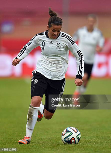 Lena Lotzen of Germany runs with the ball during the FIFA Women's World Cup 2015 Qualifier between Germany and Slovakia at Osnatel Arena on May 8,...