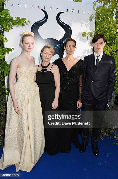 Elle Fanning, Lesley Manville, Angelina Jolie and Sam Riley arrive at a private reception as costumes and props from Disney's "Maleficent" are...