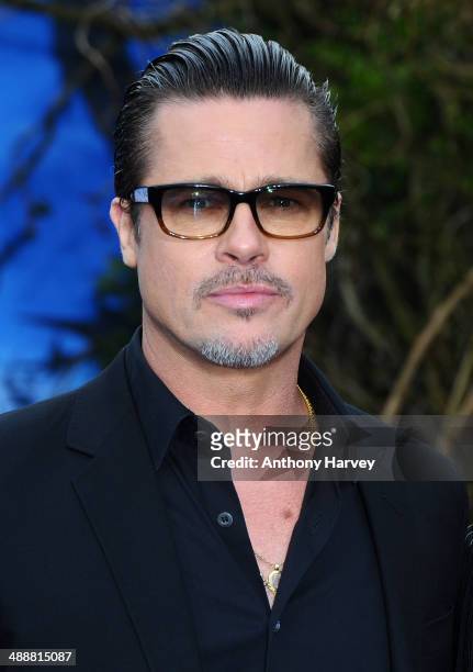 Brad Pitt attends a private reception as costumes and props from Disney's "Maleficent" are exhibited in support of Great Ormond Street Hospital at...