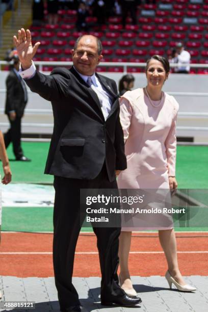 Luis Guillermo Solis and his wife Mercedes Peñas waive the crowd before the Presidential Inauguration Ceremony at National Stadium on May 08, 2014 in...