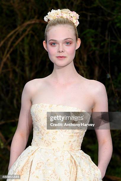 Elle Fanning attends a private reception as costumes and props from Disney's "Maleficent" are exhibited in support of Great Ormond Street Hospital at...