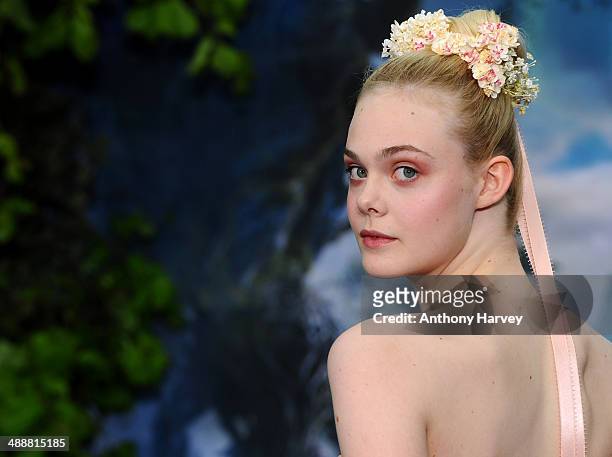 Elle Fanning attends a private reception as costumes and props from Disney's "Maleficent" are exhibited in support of Great Ormond Street Hospital at...