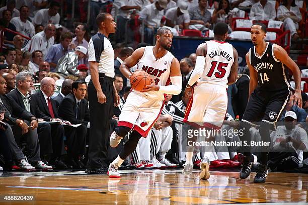Dwyane Wade of the Miami Heat looks to pass the ball against the Brooklyn Nets during Game Two of the Eastern Conference Semifinals of the 2014 NBA...