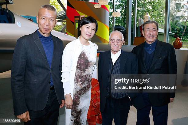 Contemporary artist Guo-Qiang Cai, his assistant, contemporary artists Alessandro Mendini and Issey Miyake attend the 'Fondation Cartier pour l'art...