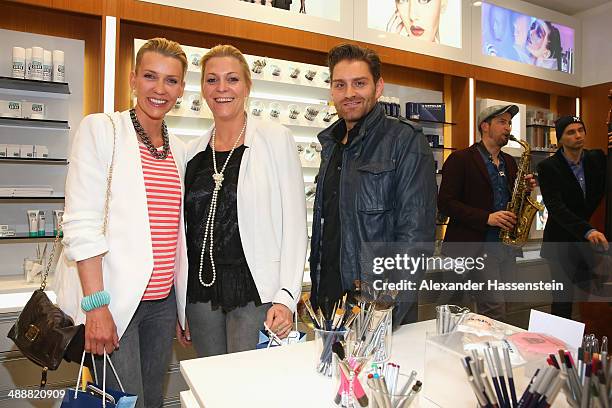 Alexandra Rietz attends with Diana Spoerl and Bane Katic the Kryolan Make-Up Shop Opening on May 8, 2014 in Munich, Germany.