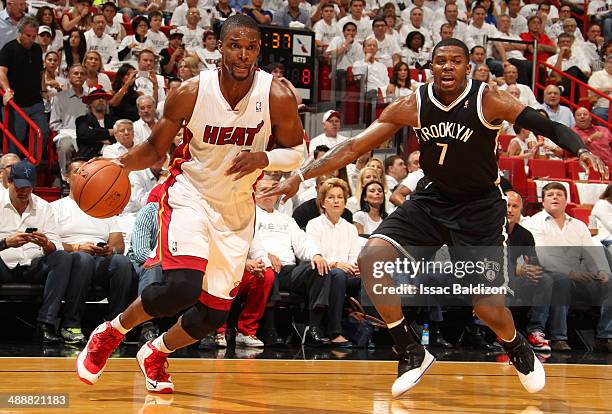 Chris Bosh of the Miami Heat handles the ball against the Brooklyn Nets in Game Two of the Eastern Conference Semifinals of the 2014 NBA playoffs at...