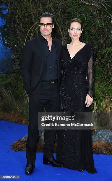 Brad Pitt and Angelina Jolie attends a private reception as costumes and props from Disney's "Maleficent" are exhibited in support of Great Ormond...