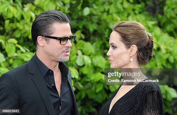 Brad Pitt and Angelina Jolie attends a private reception as costumes and props from Disney's "Maleficent" are exhibited in support of Great Ormond...