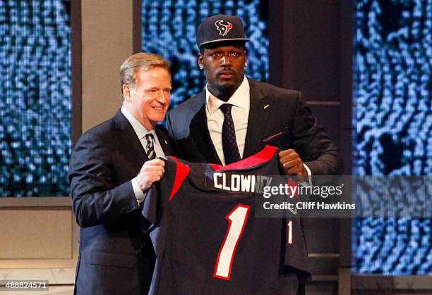 Jadeveon Clowney of the South Carolina Gamecocks stands on stage with NFL Commissioner Roger Goodell after he was picked overall by the Houston...