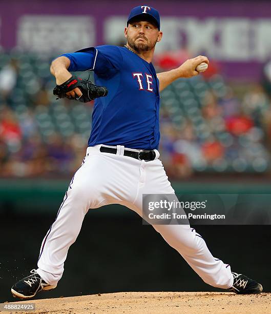 Matt Harrison of the Texas Rangers pitches against the Colorado Rockies in the top of the first inning at Globe Life Park in Arlington on May 8, 2014...