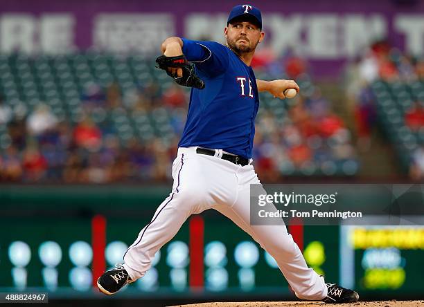Matt Harrison of the Texas Rangers pitches against the Colorado Rockies in the top of the first inning at Globe Life Park in Arlington on May 8, 2014...