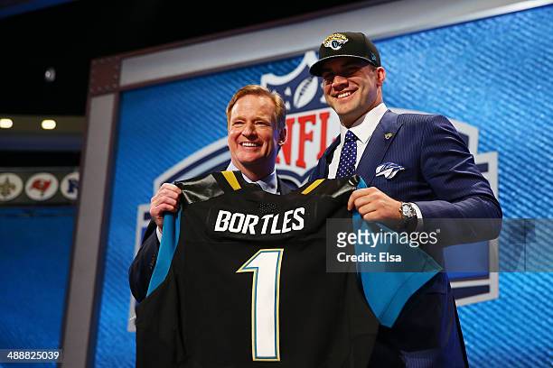Blake Bortles of the UCF Knights poses with NFL Commissioner Roger Goodell after he was picked overall by the Jacksonville Jaguars during the first...