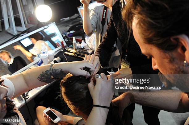 Model prepares backstage during J. Mendel Spring 2016 New York Fashion Week at 330 Hudson St on September 17, 2015 in New York City.