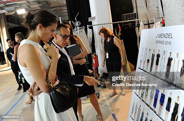 Designer Gilles Mendel speaks with Fashion News Editor for Vogue.com, Alessandra Codinha backstage during J. Mendel Spring 2016 New York Fashion Week...