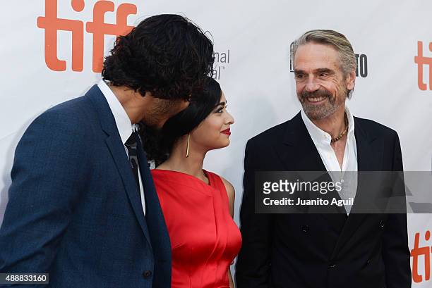 Actor Dev Patel, actress Devika Bhise and actor Jeremy Irons attends the premiere of 'The Man Who Knew Infinity' at Roy Thomson Hall on September 17,...