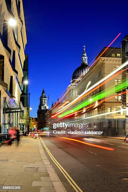 london city streets and traffic trails at twilight - london nightlife stock pictures, royalty-free photos & images