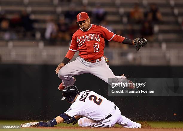 Brian Dozier of the Minnesota Twins is out at second base as Erick Aybar of the Los Angeles Angels of Anaheim jumps out off the way during the eighth...