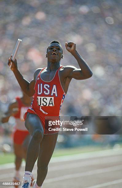 American athlete Carl Lewis crossing the line to win the final of the Men's 4 x 100 metres relay at the Los Angeles Memorial Coliseum during the...