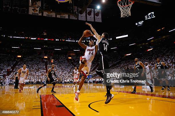Ray Allen of the Miami Heat drives against Shaun Livingston of the Brooklyn Nets during Game Two of the Eastern Conference Semifinals of the 2014 NBA...