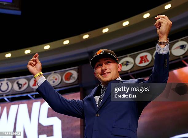 Johnny Manziel of the Texas A&M Aggies takes the stage after he was picked overall by the Cleveland Browns during the first round of the 2014 NFL...