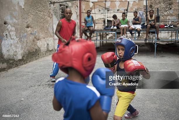 Cuban children practice on an outdoor boxing ring at a boxing school in central Havana, Cuba on September 16, 2015. The boxing school in central...