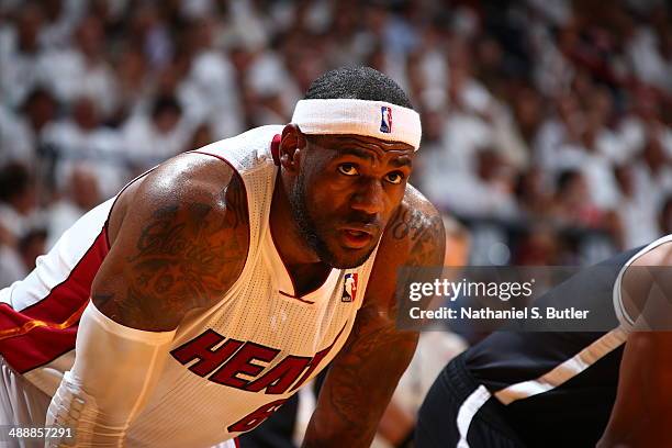 LeBron James of the Miami Heat looks on against the Brooklyn Nets during Game Two of the Eastern Conference Semifinals of the 2014 NBA playoffs at...