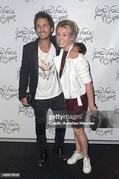 Mickael Miro and Louise Ekland attend the 'Leurs Voix pour l'Espoir' photocall at L'Olympia on September 17, 2015 in Paris, France.