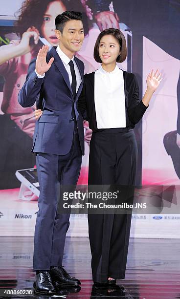 Si-Won of Super Junior and Hwang Jung-Eum pose for photographs during the MBC drama 'She Was Pretty' press conference at MBC on September 14, 2015 in...