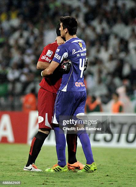 The players of Defensor Sporting celebrate the second goal of his team during a quarterfinal match between Atletico Nacional and Defensor Sporting as...