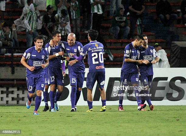 The players of Defensor Sporting celebrate the first goal of his team during a quarterfinal match between Atletico Nacional and Defensor Sporting as...