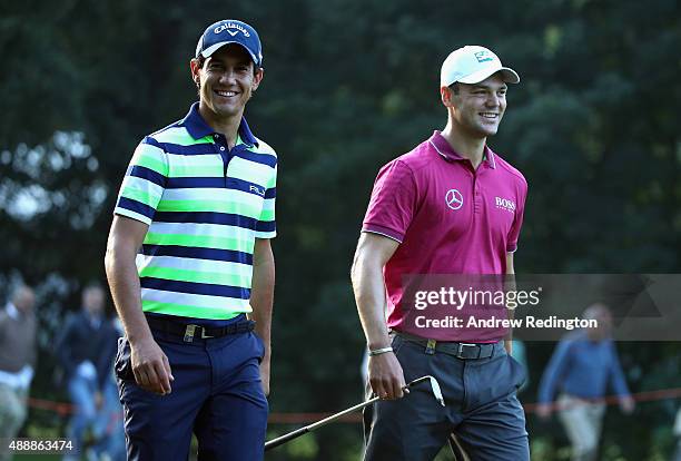 Matteo Manassero of Italy and Martin Kaymer of Germany share a joke on the tenth hole during the second round of the 72nd Open d'Italia at Golf Club...