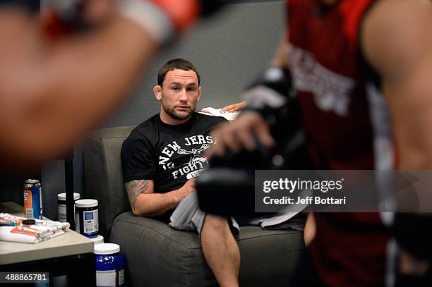 Coach Frankie Edgar watches as team Edgar fighter Dhiego Lima warms up before facing team Penn fighter Tim Williams in their preliminary fight during...