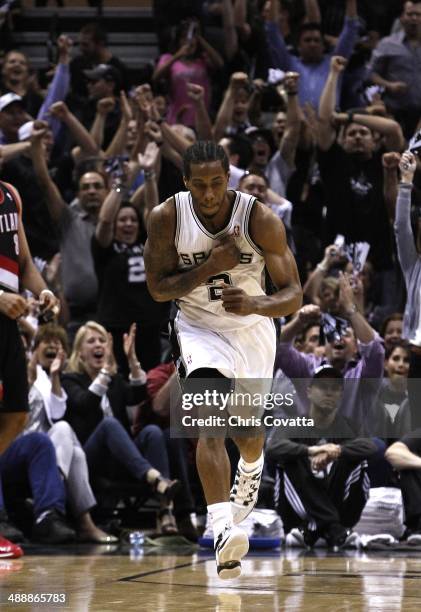 Kawhi Leonard of the San Antonio Spurs reacts after draining a three point shoot against the Portland Trail Blazers in Game Two of the Western...