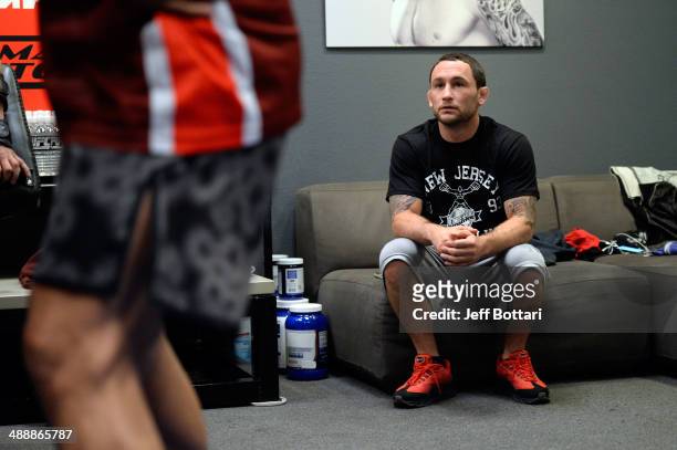 Coach Frankie Edgar watches as team Edgar fighter Dhiego Lima warms up before facing team Penn fighter Tim Williams in their preliminary fight during...