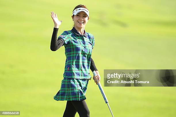 Makoto Takemura of Japan smiles after making her birdie putt on the 18th green during the first round of the Munsingwear Ladies Tokai Classic at the...