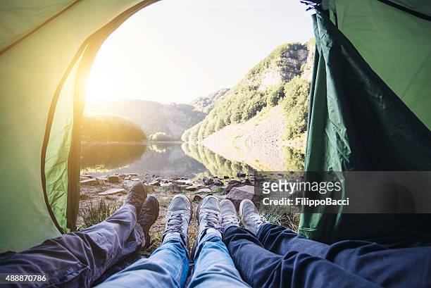 in a tent near the lake with friends - inside of tent stock pictures, royalty-free photos & images