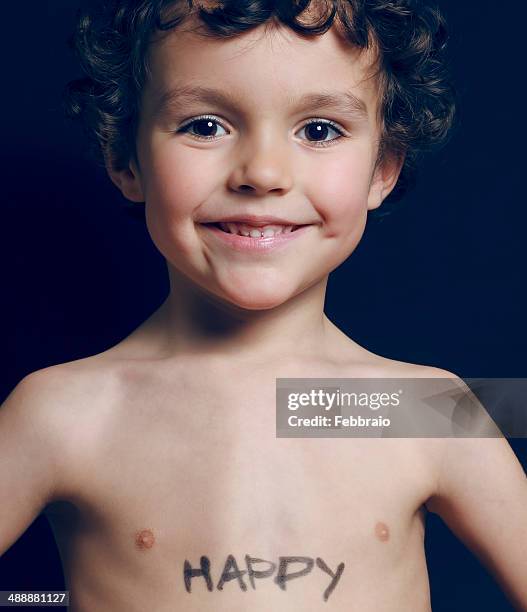 portrait of child with the word happy written - happy stockfoto's en -beelden