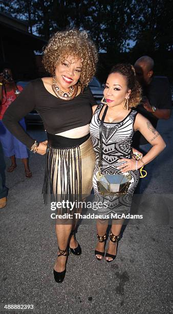 Jamie Foster Brown and Tameka "Tiny" Harris attend the Sister 2 Sister Ladies Night at Mason Murer Art Gallery on May 8, 2014 in Atlanta, Georgia.