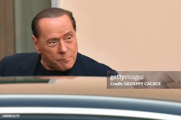 Italian former Prime Minister Silvio Berlusconi arrives at the Catholic hospice "Sacra Famiglia" in Cesano Boscone to begin community service for tax...