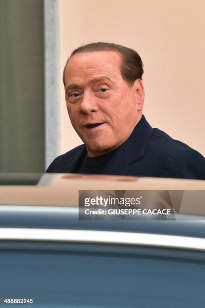 Italian former Prime Minister Silvio Berlusconi arrives at the Catholic hospice "Sacra Famiglia" in Cesano Boscone to begin community service for tax...