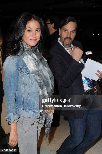Actress Emmanuelle Chriqui gets photobombed by photographer Todd Williamson at the Los Angeles premiere of "Fed Up" at Pacfic Design Center on May 8,...