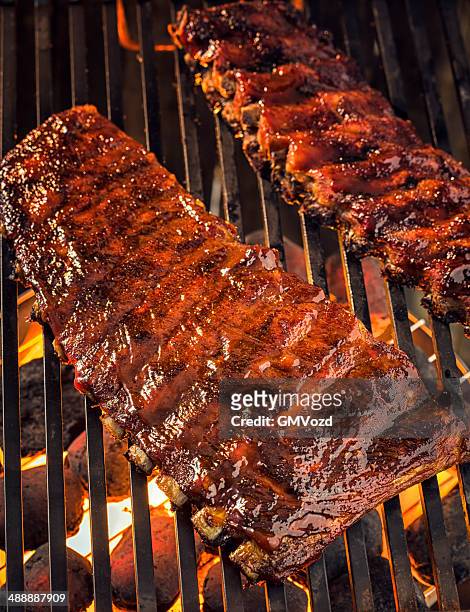 marinated bbq pork ribs on barbecue grill - barbeque sauce stock pictures, royalty-free photos & images