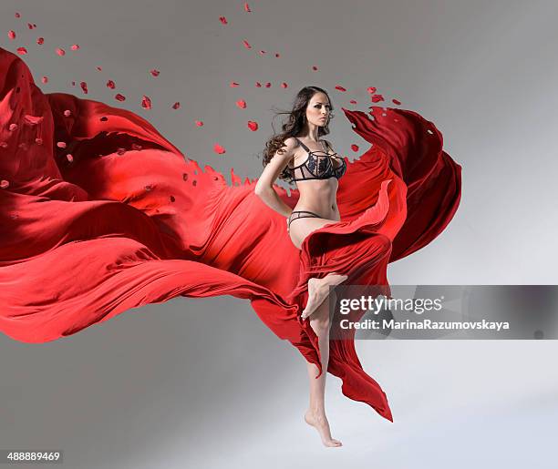girl running through the fabric - hurricane wind stock pictures, royalty-free photos & images