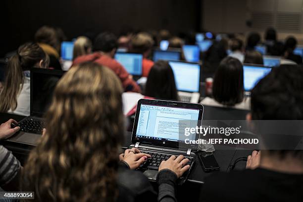 Students of the Catholic University of Lyon use laptops to take notes in a classroom, on September 18, 2015 in Lyon, eastern France. AFP PHOTO / JEFF...