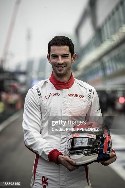 Manor Marussia F1 Team's US driver Alexander Rossi poses for a photo before the practice session of the Formula One Singapore Grand Prix in Singapore...
