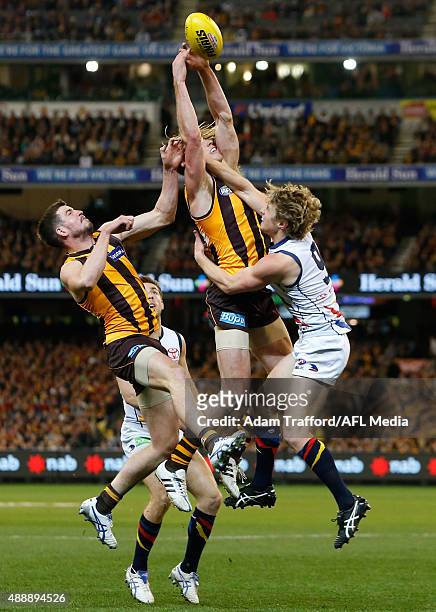 Ryan Schoenmakers of the Hawks attempts to mark over Ben Stratton of the Hawks and Rory Sloane of the Crows during the 2015 AFL Second Semi Final...
