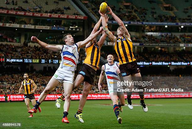 Brian Lake and Ben McEvoy of the Hawks compete for the ball with Josh Jenkins of the Crows during the 2015 AFL Second Semi Final match between the...